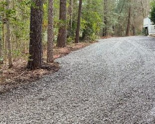 gravel driveway on a wooded lot