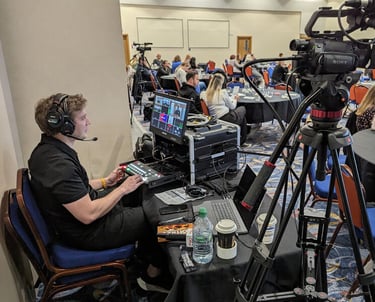 Videographer managing the event recording setup