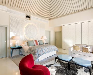 Master suite in the guest house of Villa El Rincon, Marbella, featuring stunning garden and sea views.