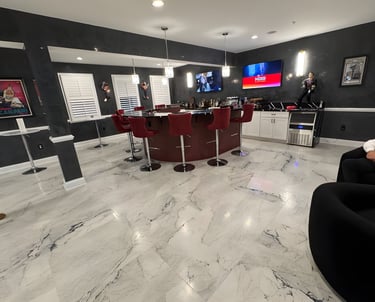 After image, a refreshed space featuring modern flooring, updated paint, and a custom bar setup.