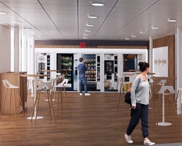 espace de travail aménagée avec des machines pour la pause café ou déjeuner