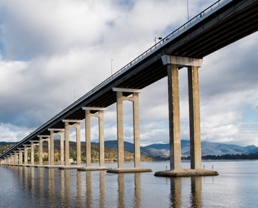 tasman bridge with water and hills in background