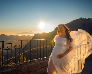 a pregnant woman in a white dress with a veil