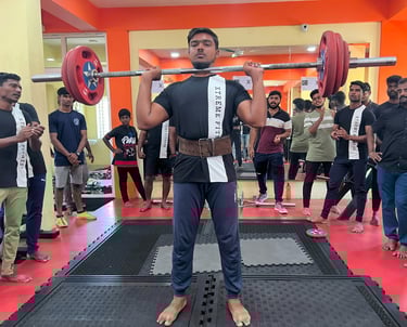 man lifting weight in gym.