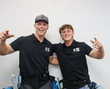 two men standing next to each other with thumbs up