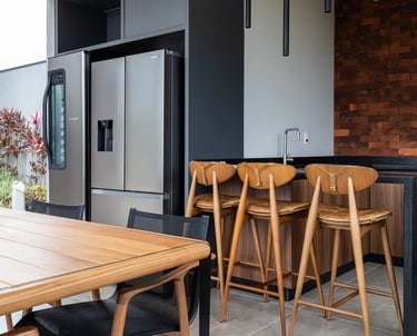 a kitchen with a table and chairs and a bowl of fruit