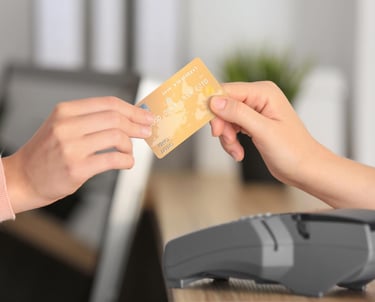 a person is paying with a credit card