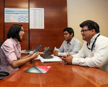 a group of doctors and nurses sitting around a table