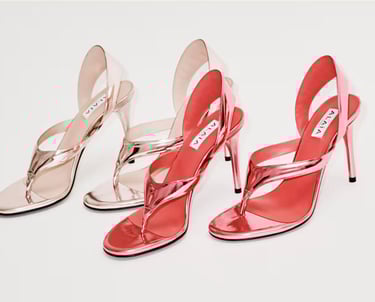 Three pairs of metallic Alaïa high-heeled sandals in pink and nude.