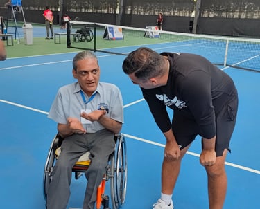 Wheelchair athletes and tennis players working wtih Cesar Performance Coach