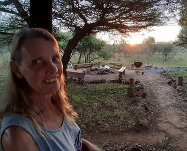 Fire pit area next to communal kitchen for the affordable glamping dome tent accommodation in Hluhluwe