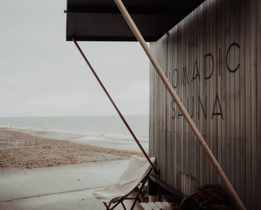 photo of wood fired nomadic sauna on the coast