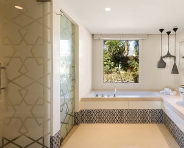 Sleek, modern guest bathroom featuring geometric patterns at Villa El Rincon.