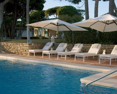 Sun loungers by the main pool at Villa El Rincon