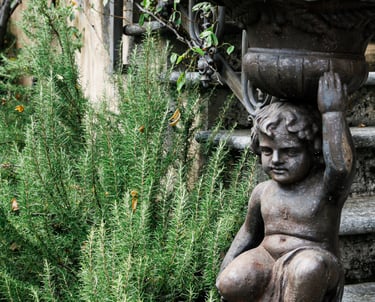 Tuscan-inspired herb garden with stone accents and Mediterranean-style plantings.