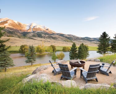 a fire pit with chairs and a fire pit