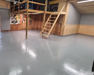 Residential garage floor with moisture barrier installed, oxide rolled in for non-slip texture