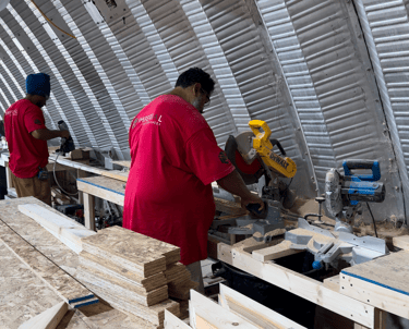 Imperial Custom Sheds crew fabricating custom shed components in workshop