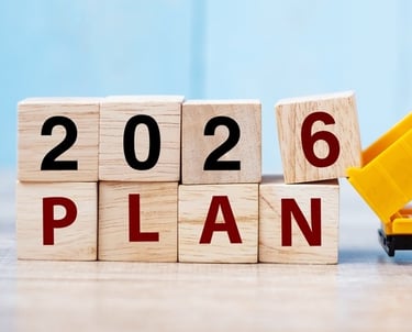 a toy truck with a dump truck in the background