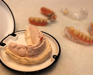 a plate with a tooth prosthesis