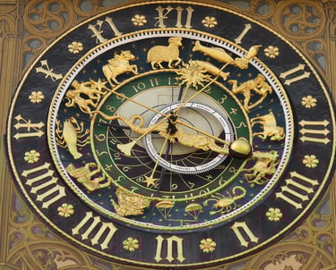 simbolički prikaz sata s astrološkim simbolima