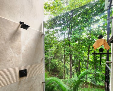 a bathroom with a shower and a shower