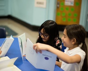 Students enjoy sharing their workbooks with each other.