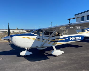a small plane parked in front of a building