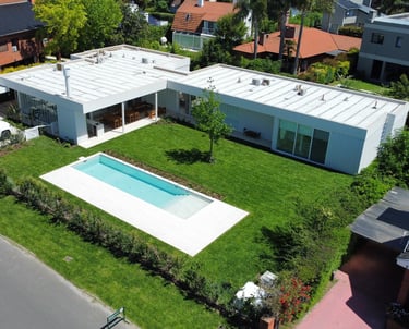a house with a pool and a swimming pool
