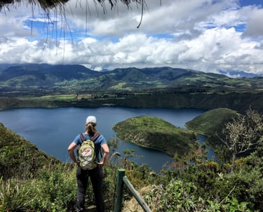 hiker overlooking Cuicocha lake