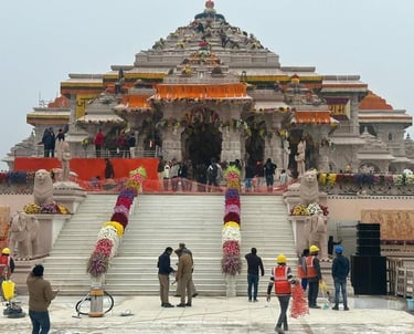 a group of people standing around a large building