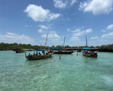 Local tour guide welcoming tourists on Safari Blue Zanzibar boat tour, guiding snorkeling and marine life experience