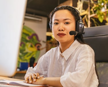 a woman in a headset with a headset and a microphone