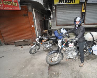 Tracey Billington riding the Leh to Manali highway over the great Himalayan range, Ladakh, India 