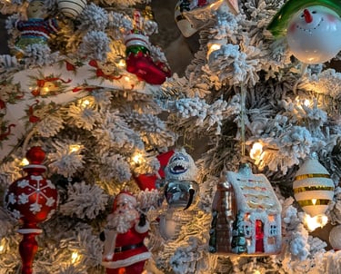 Close-up of decorated holiday tree with ornaments used for seasonal home and garden styling.