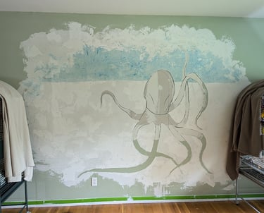 Creating a 3D relief wall mural with joint compound while mixing chalk pastel dust into the compound for color and affect.
