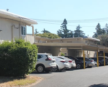 cars in off street parking lot at university commons apartments