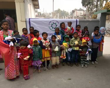 a group of children and adults posing for a picture