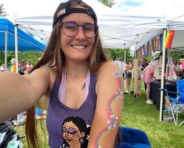 A smiling woman in a tent