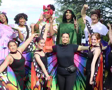 Encanto Familia posing for a photo at a parade
