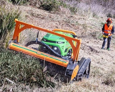 Green Climber LV 600 Pro Model mowing vegetation with operator in PPE safe distance away
