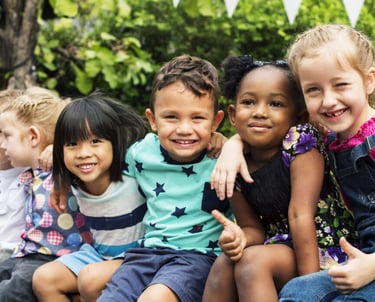 a group of children sitting on a bench