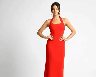 a woman in a red dress standing in front of a white background