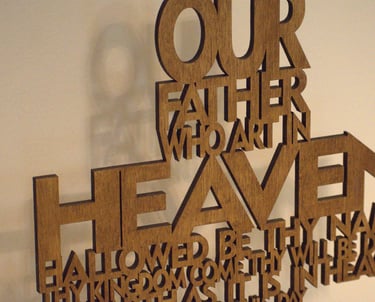 wooden cross shaped Lord's prayer carving