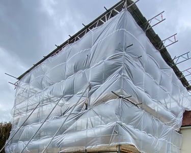Temporary roof scaffolding covering property