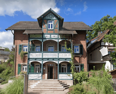 a large house with a brick building and a brick building