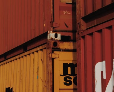 a group of containers stacked up in a row