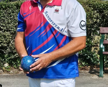 Porthcawl lawn bowls player in club shirt