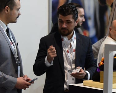 a man in a suit and tie is talking to a man in a suit