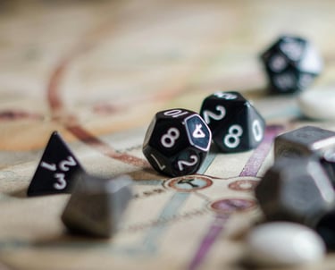 Close up of D20 dice sitting on top of a map from a tabletop game